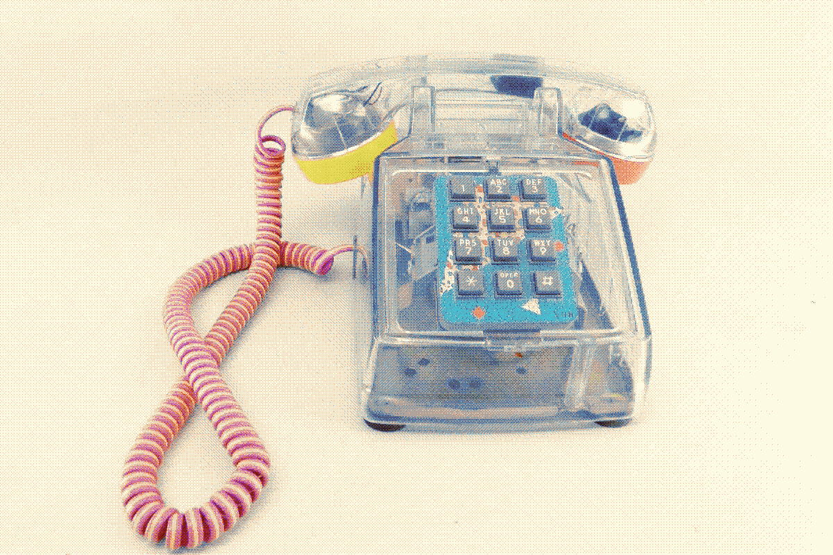 old fashioned telephone made of clear plastic